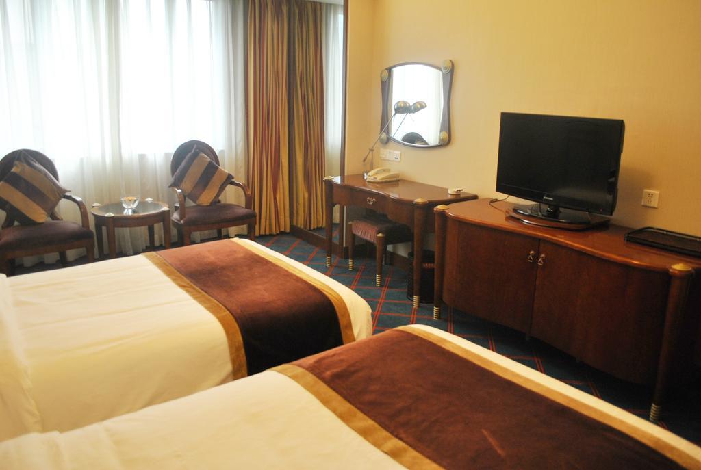 Dynasty Hotel Уенжоу Стая снимка